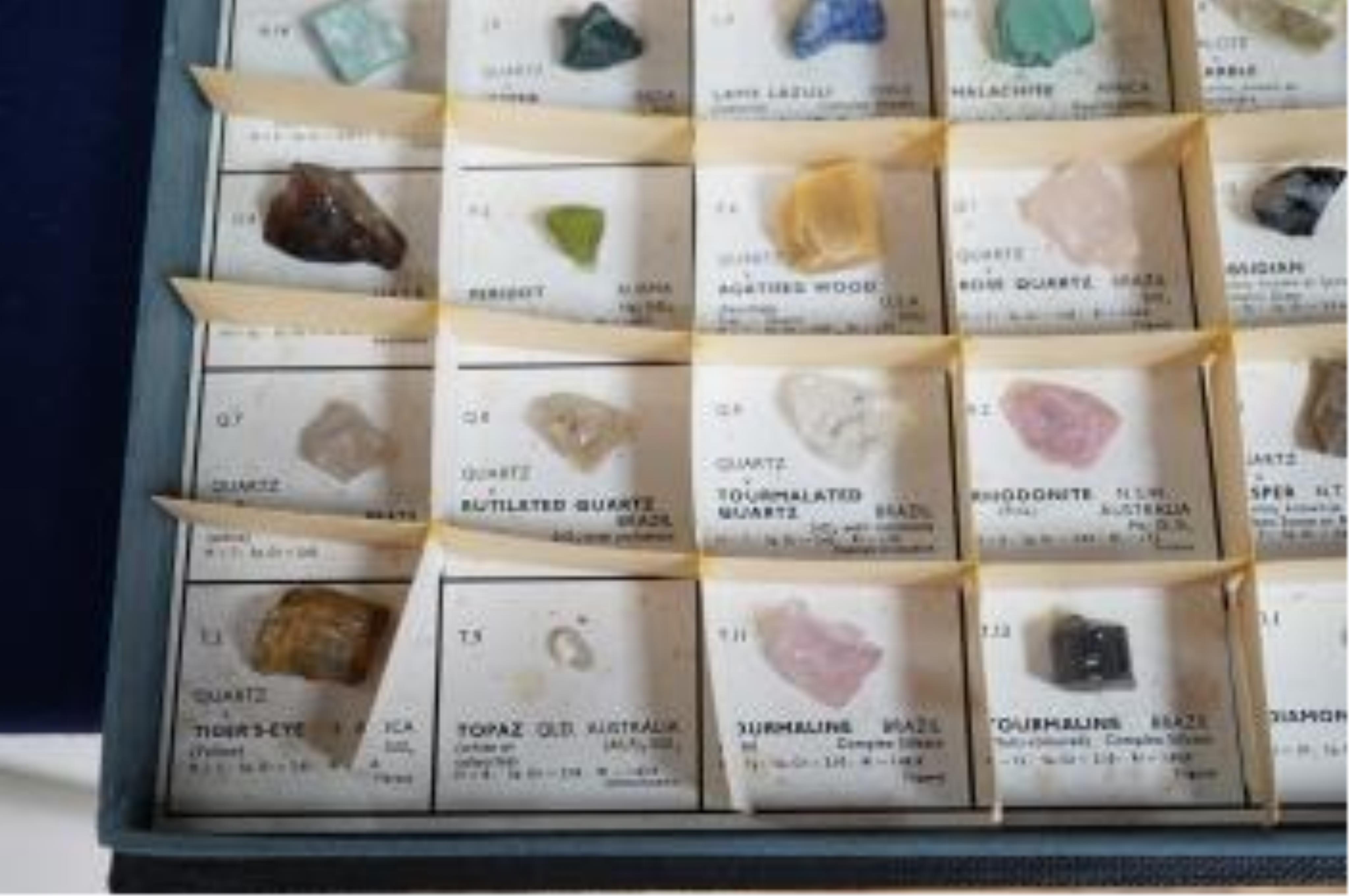 Three boxes containing unmounted cut gemstones including topaz, citrine, peridot, zircon, moonstone, etc. Condition - fair
